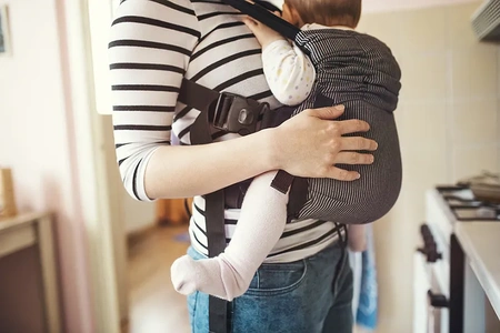 baby sleeping in baby carrier 450x300